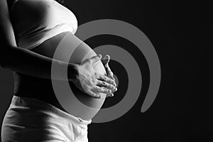 Belly of pregnant woman monochrome