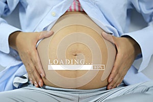 Belly of pregnant women and loading text in concept of time in c