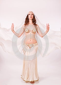 Bellydancer with veil standing