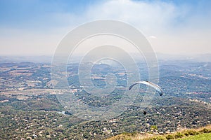 Belo Horizonte, Minas Gerais, Brazil. Paraglider flying from top