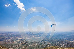 Belo Horizonte, Minas Gerais, Brazil. Paraglider flying from top