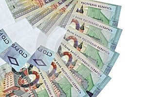 100 Belorussian rubles bills lies isolated on white background with copy space stacked in fan shape close up