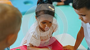 beloved preschoolers playing together in the playroom, nursery, medium shot