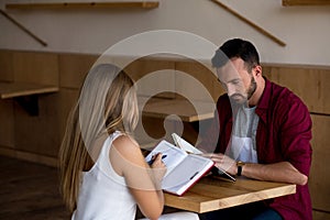 Beloved young couple making notes