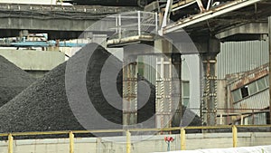 Belt conveying a coal forming a heap