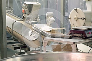 Belt conveyor for dough at a bakery factory