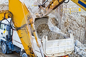 Belt excavator loading a big dumper