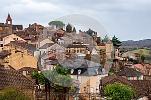 Belves, in the Dordogne-PÃ©rigord region in Aquitaine, France. Medieval village with typical houses perched on the hill