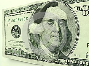 Ben Franklin Wearing Santa Hat For Christmas On This One Hundred Dollar Bill