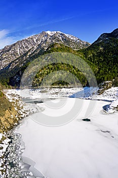 Benasque frozen reservoir Paso Nuevo Pyrenees Spain