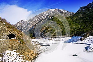 Benasque frozen reservoir Paso Nuevo Pyrenees Spain