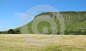 Benbulben Mountain, County Sligo, Ireland on summer day against backdrop of blue sk