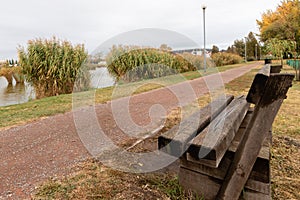 Benc in a park in front of the lake