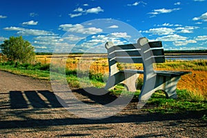 Bench along riverside path