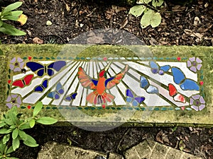 Bench with a beautiful mosaic in the garden