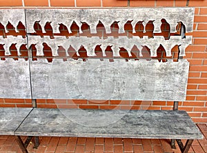 bench with bird silhouettes