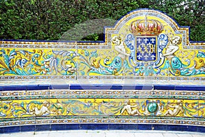 Bench covered with azulejos in Reales Alcazares, Sevilla photo