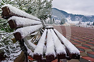 A bench covered with snow from Ortoaia, Dorna Arini, Suceava County, Romania