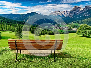 Bench for enjoying amzing panoramic view of dolomites in summer photo
