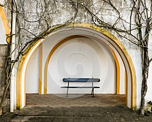 Bench Framed by Arch and Vines at Evora Convent