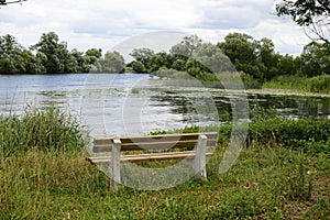 Bench in front of Havel river landscape at summer time