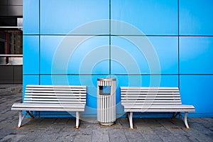 Bench and garbage can on the street