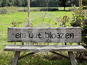 Bench with local text that you can relax here