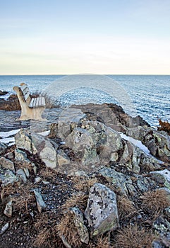 Bench on Marginal Way path in Ogunquit Maine during winter