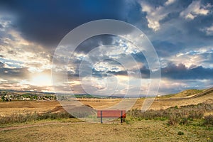 Bench Overlooking A Cochrane Sunset