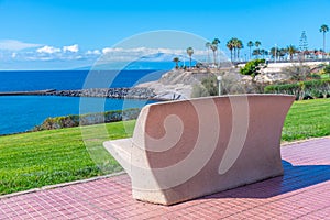 Bench overlooking Playa de Fanabe at Tenerife, Canary Islands, Spain photo