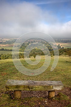Bench overlooking a town in Oxfordshire, England photo