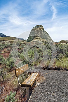 A bench overlooks a claystone formation at the Sheep Rock Unit of the John Day Fossil Beds National Monument, Oregon, USA