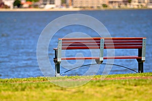 Bench in park near water