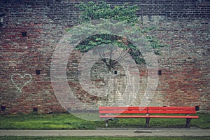 Bench in the park at the old city wall Stadtmauer near the Danube river on a foggy morning in the historic old town, Fishermen` photo