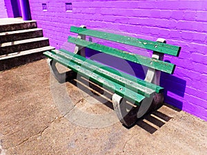 Bench seat against brick wall