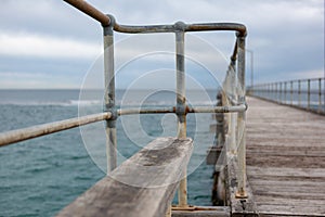 A bench seat on the Port Noarlunga Jetty with selective blue and