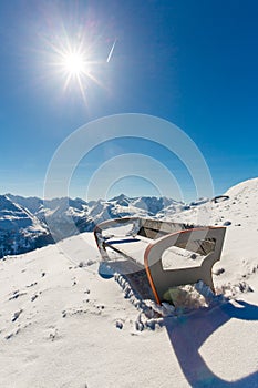 Bench in ski resort Bad Gastein in winter snowy mountains, Austria, Land Salzburg