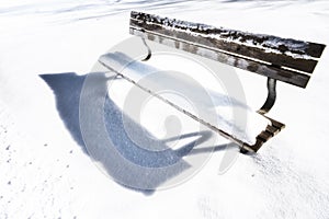 Bench on snowy winter day 122