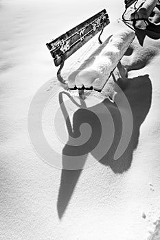 Bench on snowy winter day