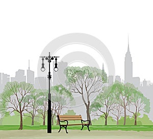 Bench and streetlight in park over city background.