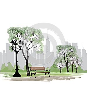 Bench and streetlight in park over city background. Landscape