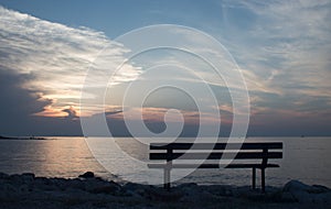 Bench at sunset in Umag