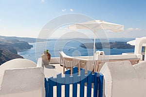 Bench on terrace overlooking Caldera of Santorini Greece