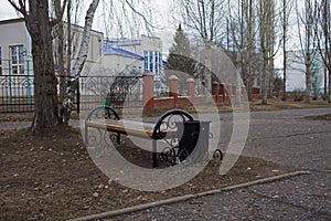 bench in town in the spring of Russia grayness and photo