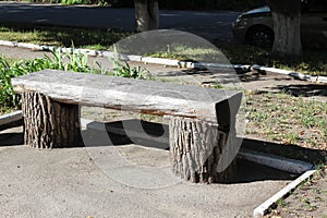 Bench from the trunk of tree