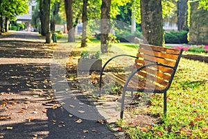 The bench by the walkway in the park in Sliac spa resort by Hotel Palace