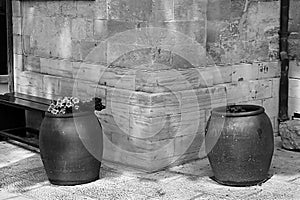 Bench and wine bowls with flowers near the Cana greek orthodox wedding church in Cana of Galilee, Kfar Kana