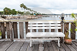 Bench wooden in restaurant at pier sea view.