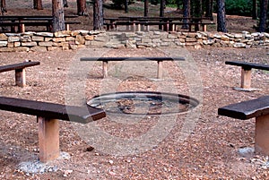 Benches around the campfire at the park