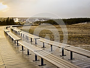 Benches on the boardwalk at Old Faithful Geyser